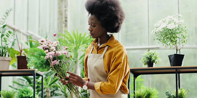 Female florist flower arranging
