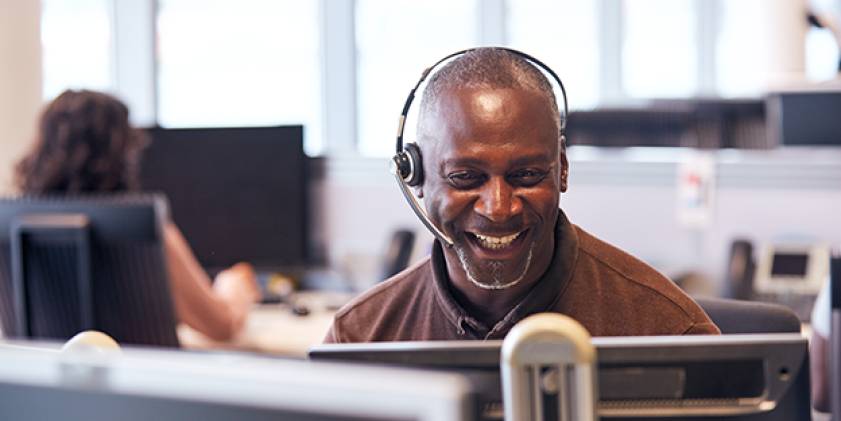 Man wearing headphones calling on PC